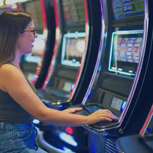 lady playing on gambling machine